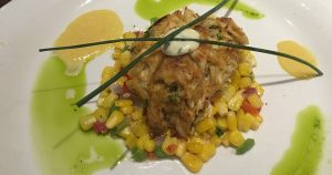 Crab Cake on a bed of corn salsa