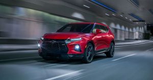 Red 2020 Chevrolet Blazer driving in a tunnel road
