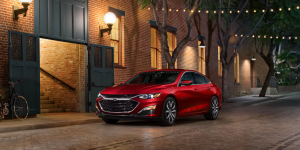 red 2021 Chevrolet Malibu parked on a street