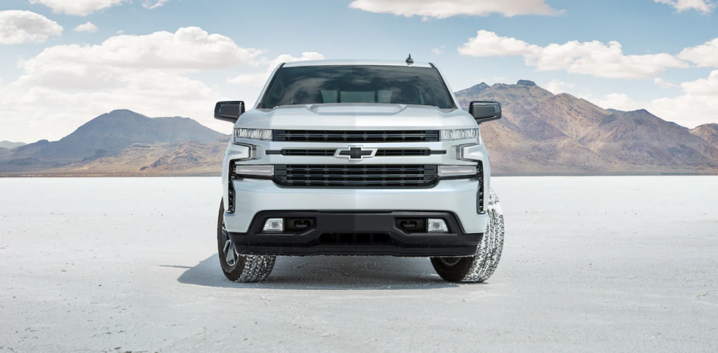 2022 Chevrolet Silverado 1500 in silver parked in sand.