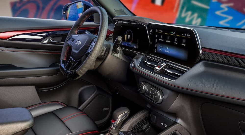The black interior of a 2024 Chevy Trailblazer RS is shown from the passenger side.