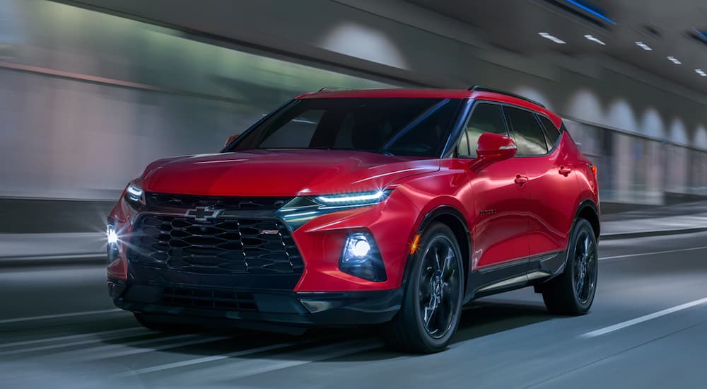 A red 2025 Chevy Blazer RS is shown from the front at an angle.