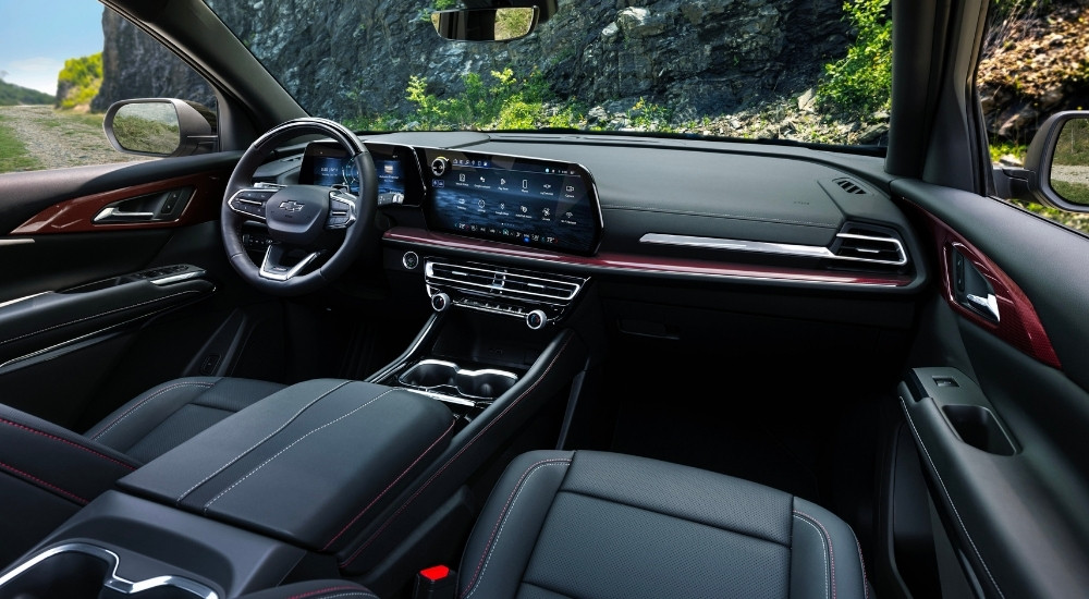 The black interior is shown in a  2024 Chevy Traverse for sale.