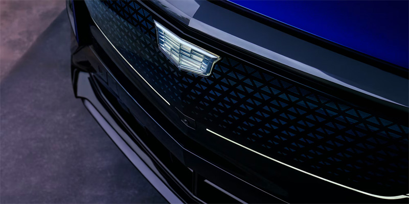 The front end of the 2025 Cadillac LYRIQ showing the Cadillac emblem on the front grill