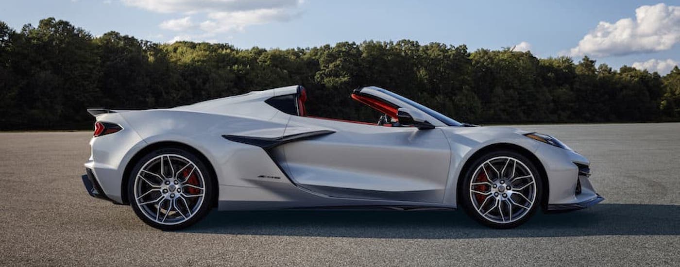 A silver 2023 Chevy Corvette Z06 is shown from the side while parked.