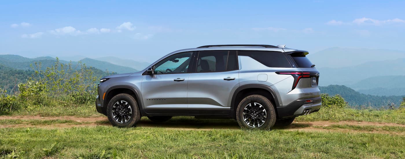 A silver 2024 Chevy Traverse Z71 is shown from the side while off-road.